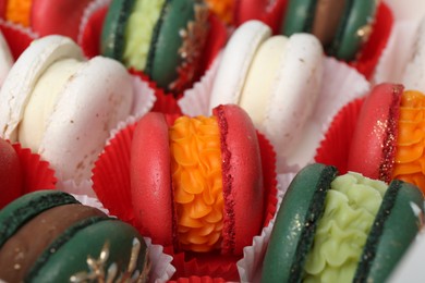 Photo of Many different tasty Christmas macarons, closeup view