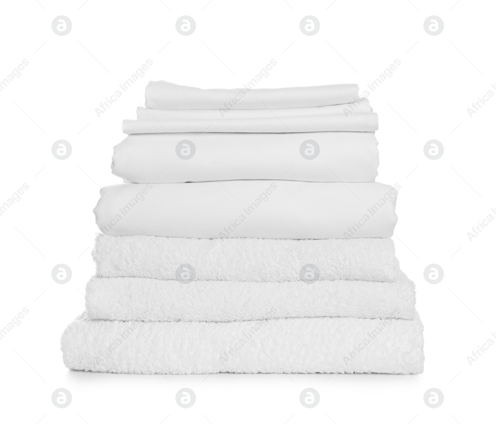 Photo of Stack of towels and bed sheets on white background