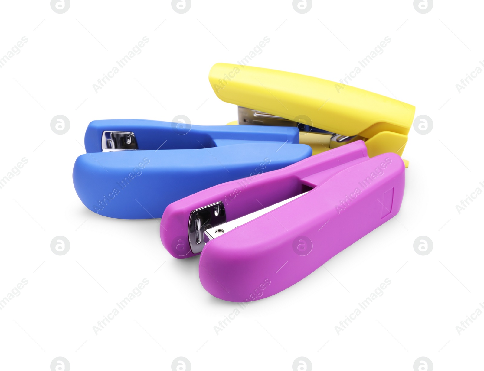 Photo of Many new bright staplers isolated on white