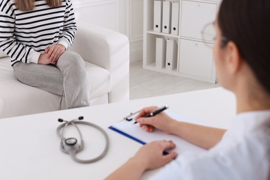 Photo of Young woman having appointment with STD specialist in clinic, closeup