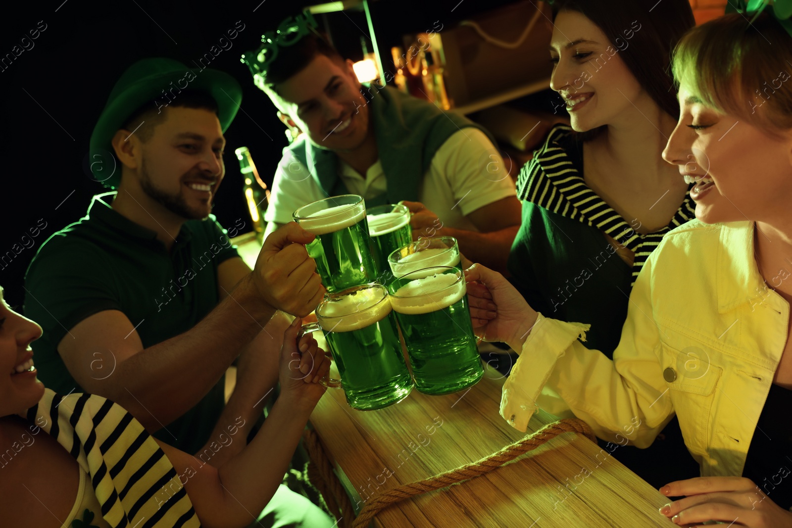 Photo of People with beer celebrating St Patrick's day in pub