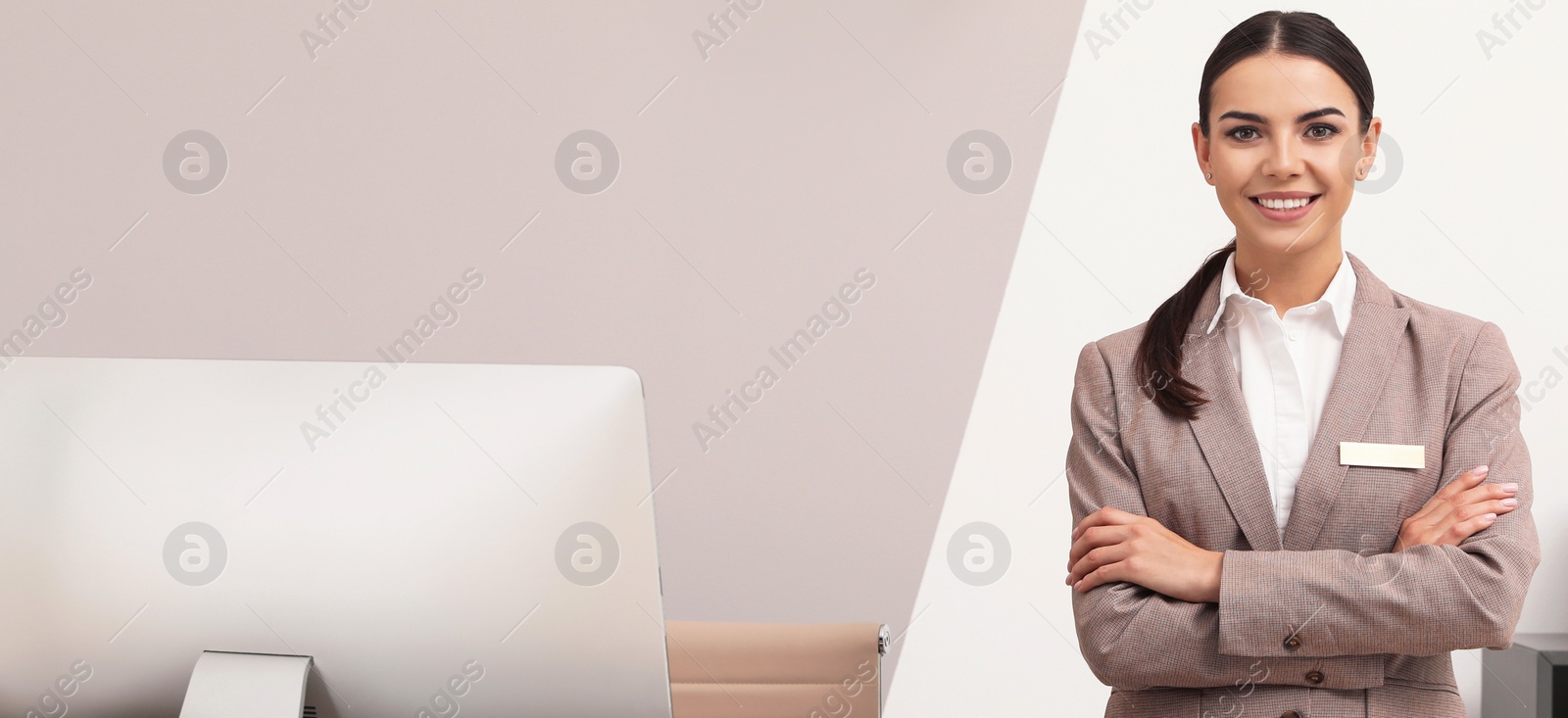 Image of Portrait of receptionist in modern hotel. Banner design