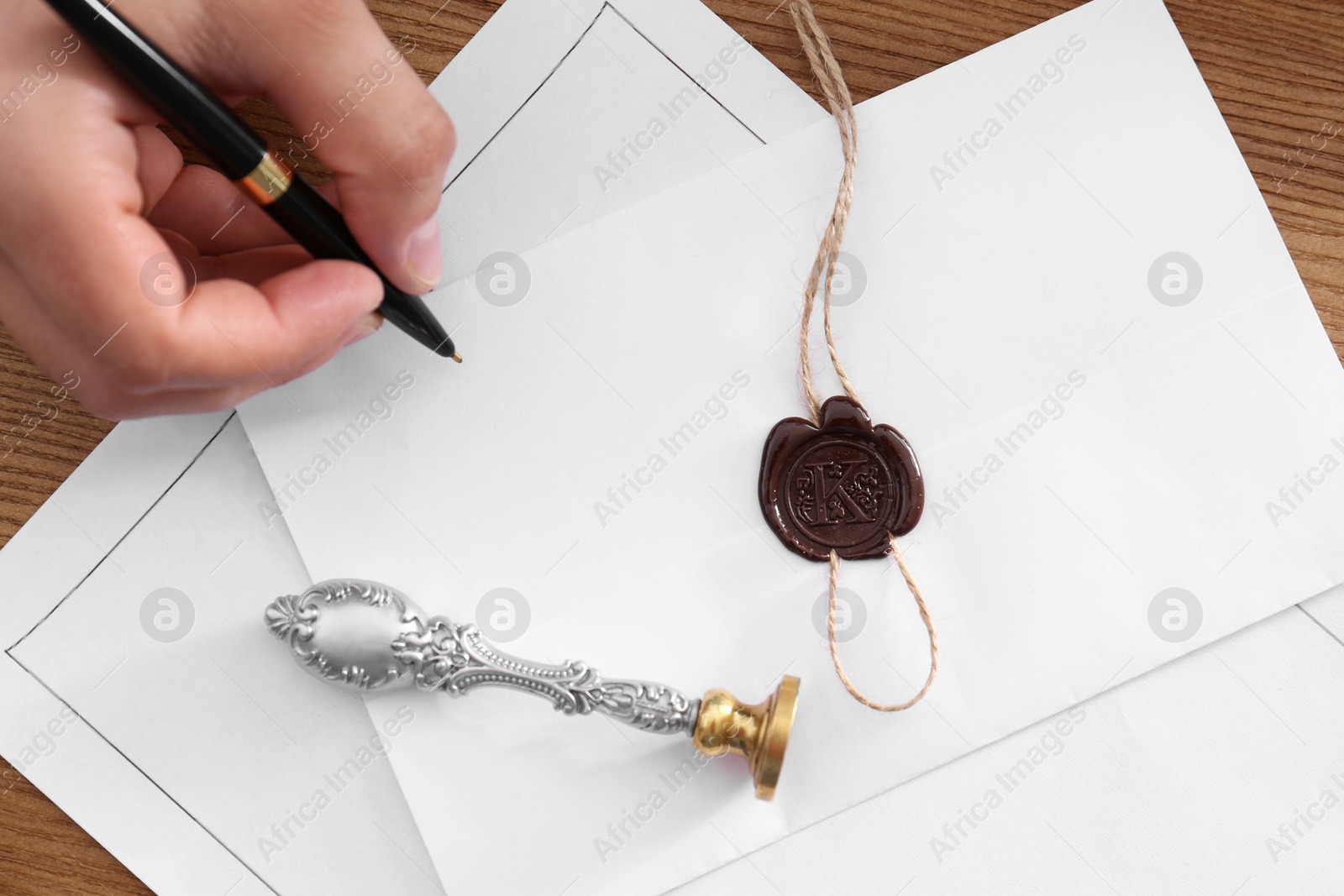 Photo of Male notary working with documents at table, top view