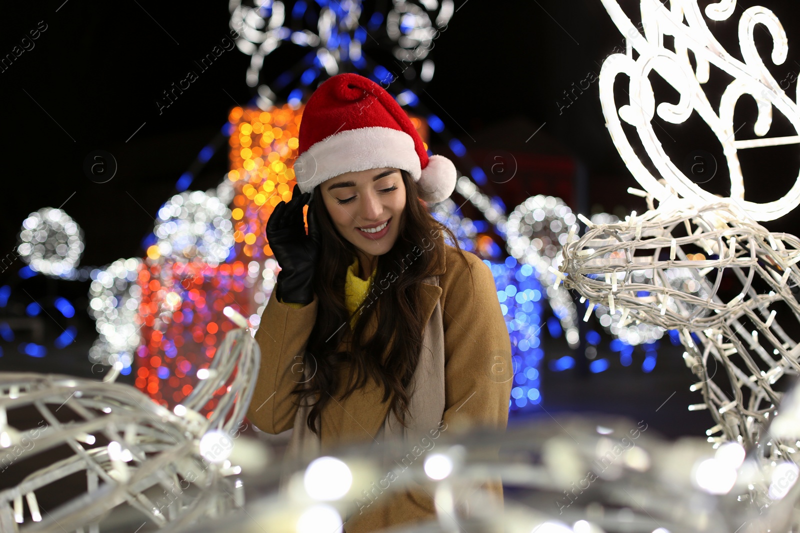 Photo of Young woman spending time at Christmas fair