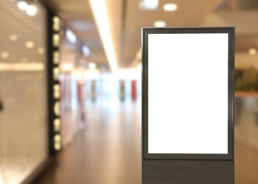 Blank advertising board in shopping mall. Mockup for design