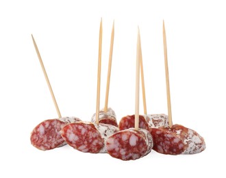 Photo of Toothpick appetizers. Tasty sausage pieces on white background