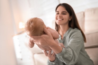 Mother with her newborn baby at home