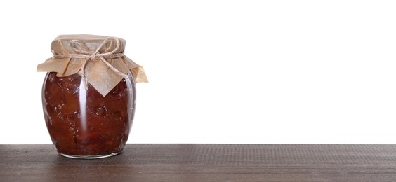 Photo of Jar with delicious apple jam on wooden table against white background