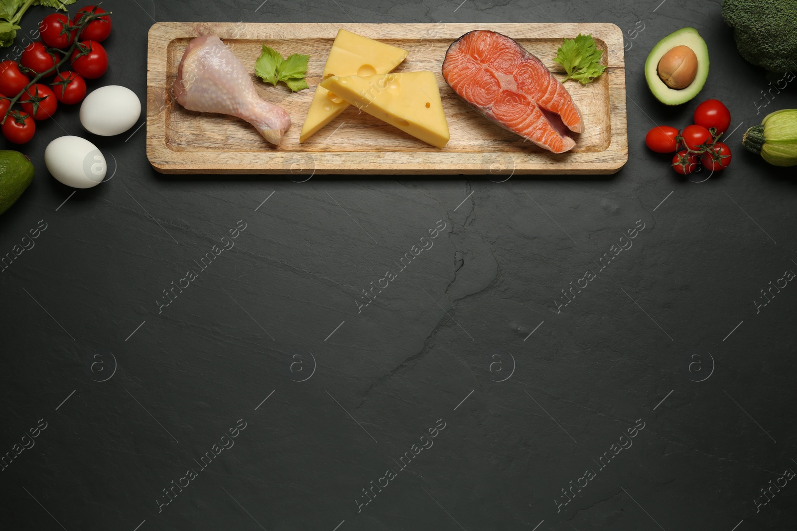 Photo of Flat lay composition with keto diet products on black table, space for text