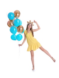 Young woman with crown and air balloons on white background