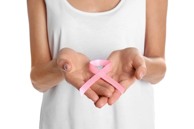 Photo of Woman holding pink ribbon on white background, closeup. Breast cancer awareness