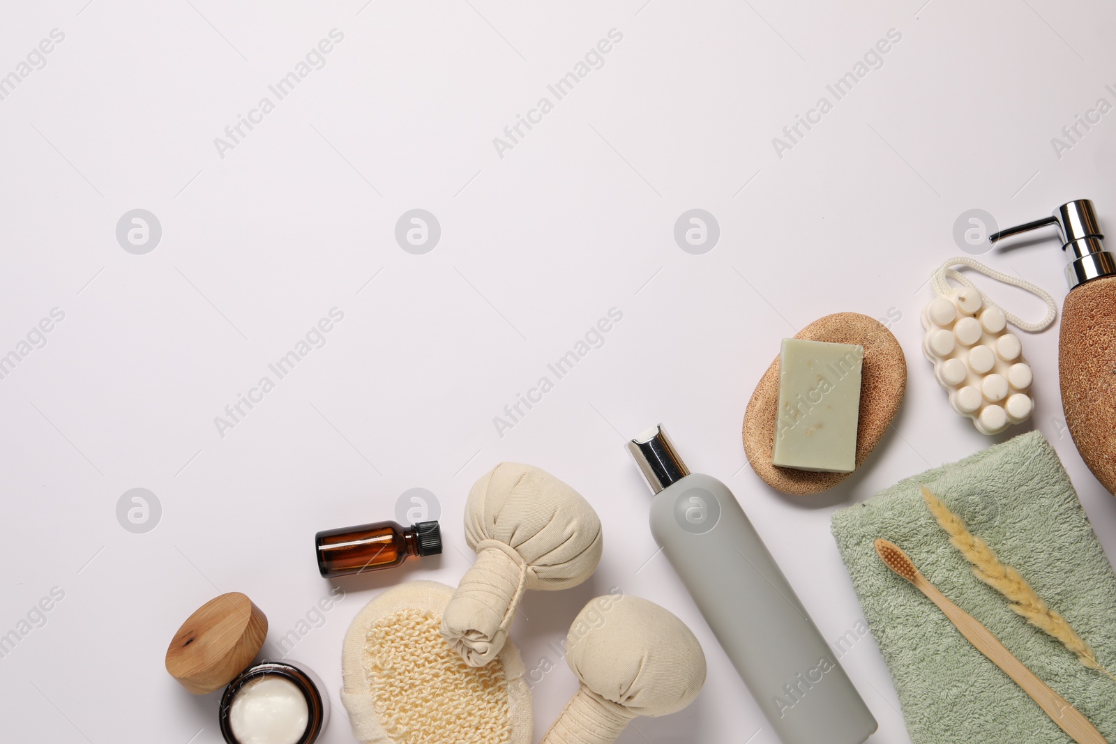 Photo of Bath accessories. Different personal care products and dry spikelet on white background, flat lay with space for text