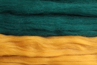 Colorful felting wool as background, closeup view