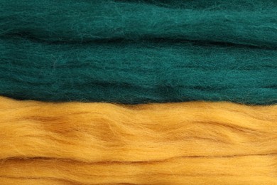 Photo of Colorful felting wool as background, closeup view