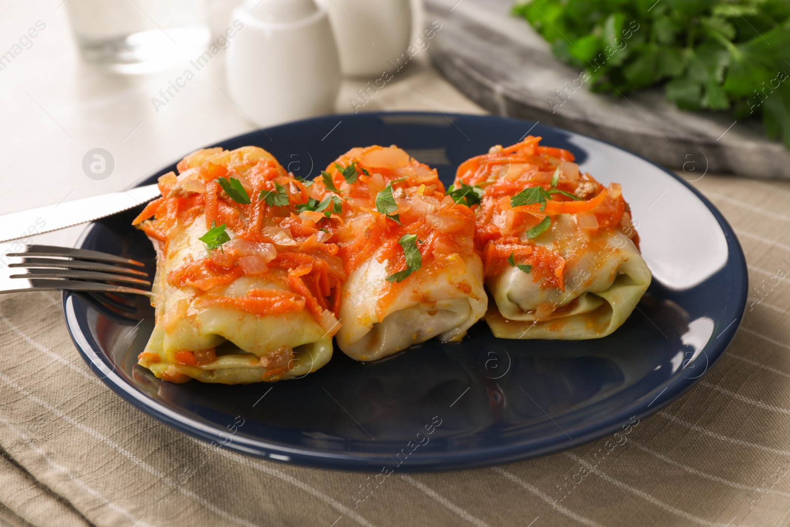 Photo of Delicious cabbage rolls served on plate, closeup