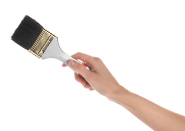 Photo of Woman holding paint brush on white background, closeup