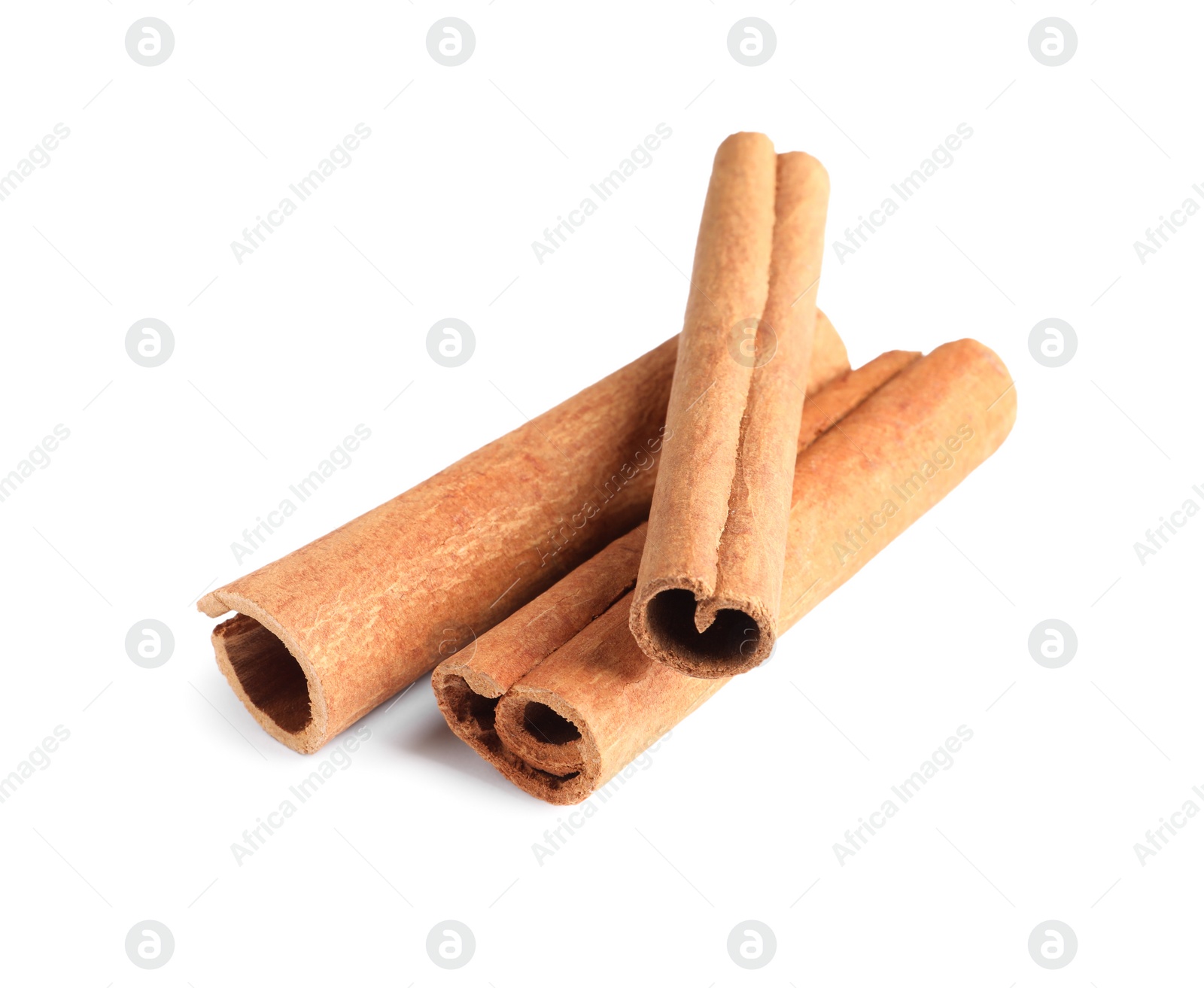 Photo of Three aromatic cinnamon sticks isolated on white