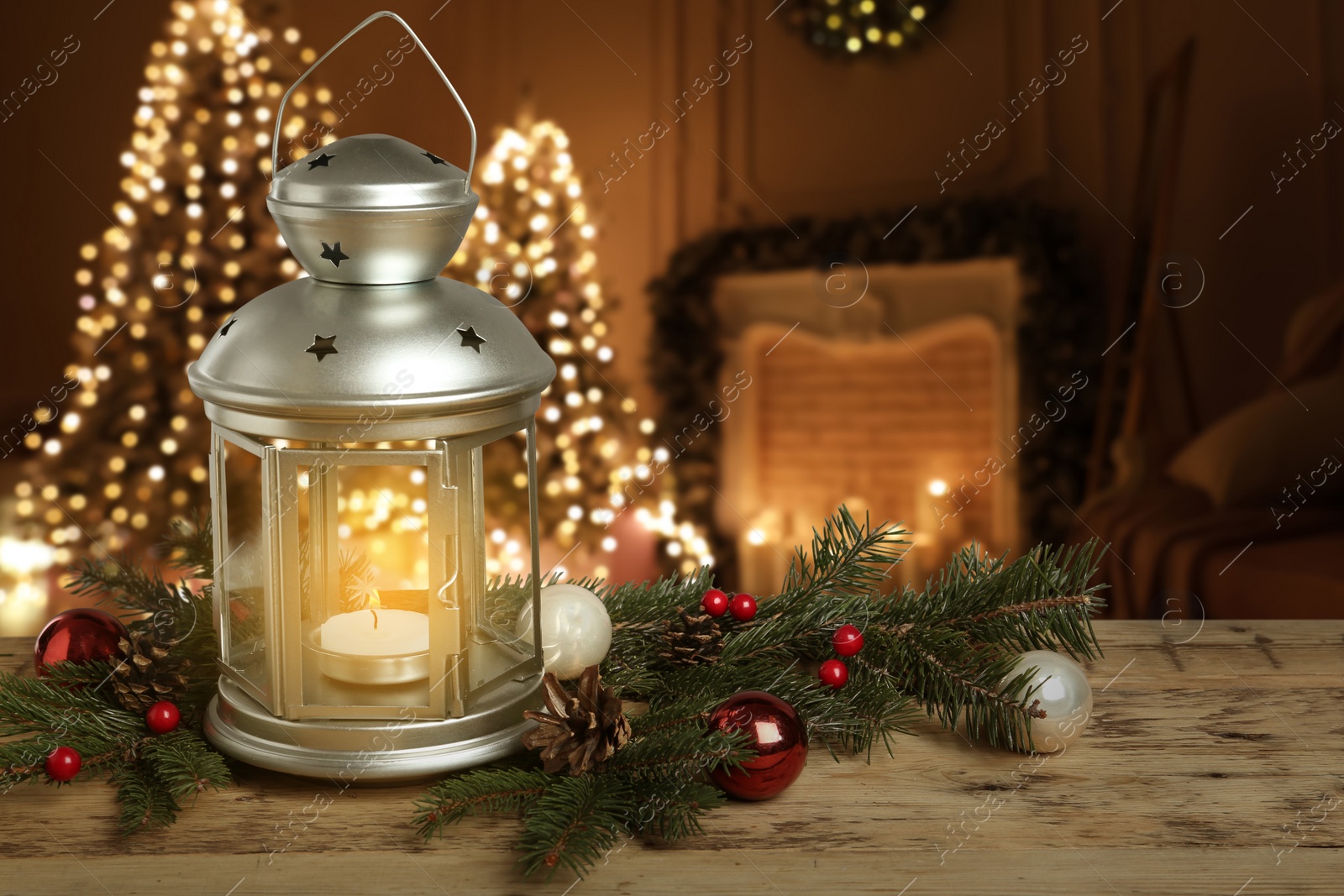 Image of Composition with Christmas lantern on table in decorated room