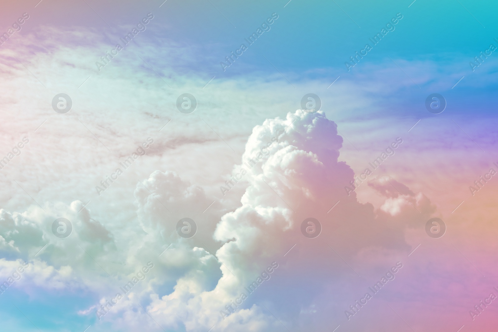 Image of Fantasy world. Picturesque view of beautiful magic sky with fluffy clouds, toned in pastel rainbow or unicorn colors