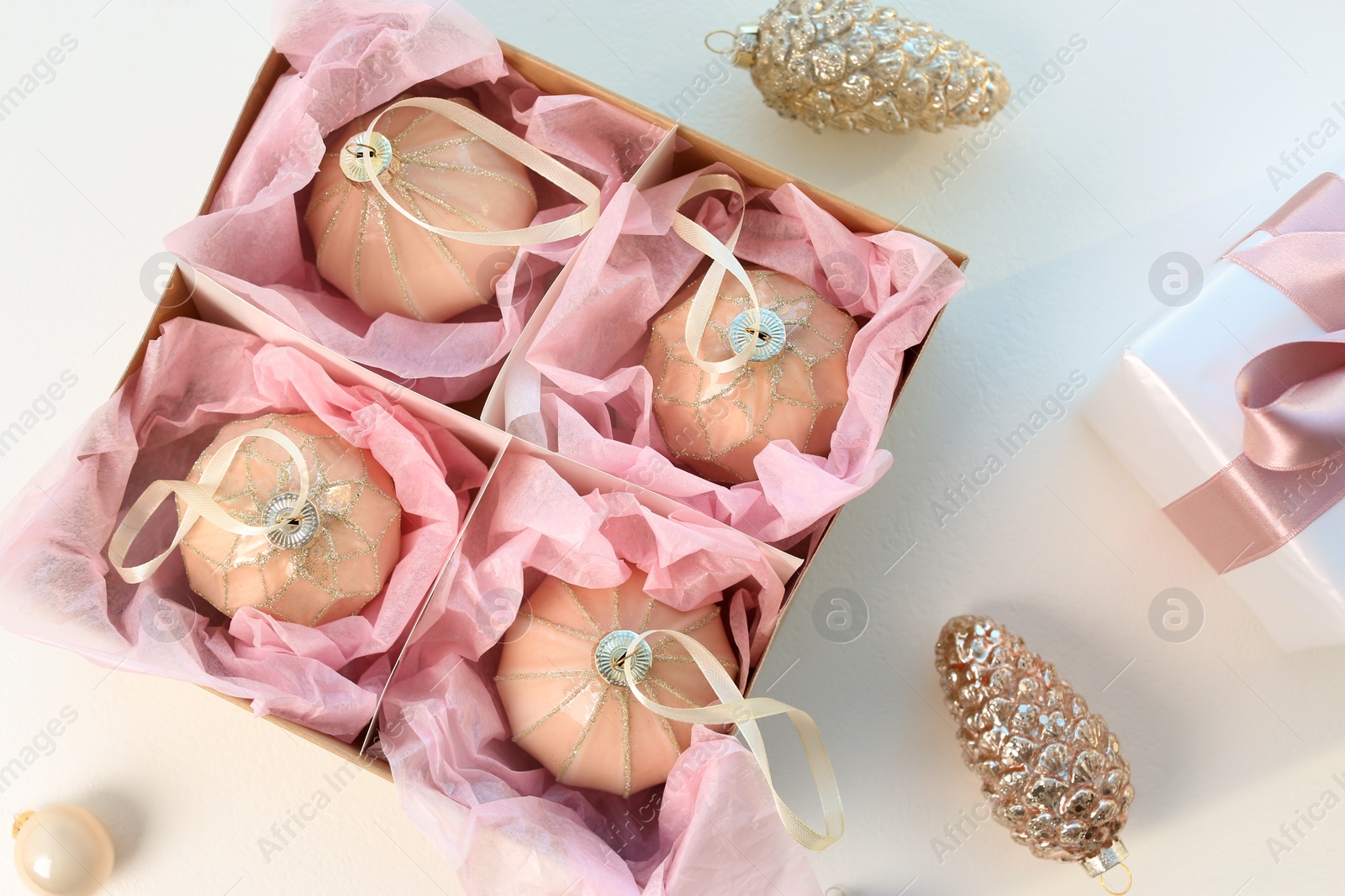 Photo of Beautiful Christmas baubles on white background, flat lay