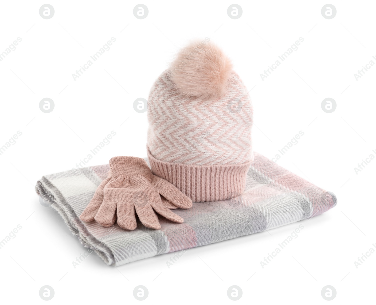 Photo of Woolen gloves, scarf and hat on white background