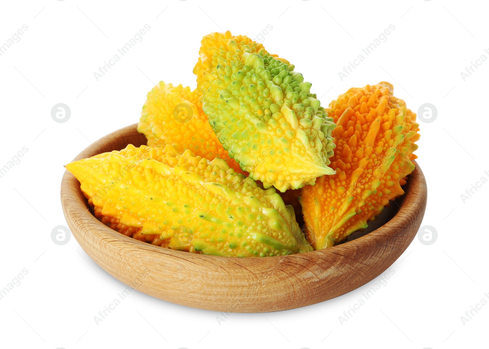 Photo of Wooden bowl with fresh ripe bitter melons on white background