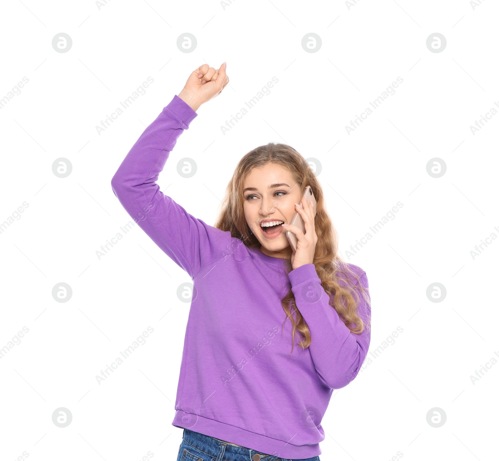 Photo of Happy young woman with smartphone celebrating victory on white background