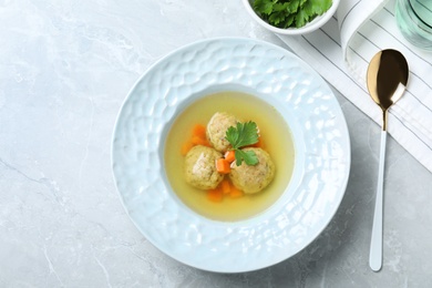 Photo of Flat lay composition with Jewish matzoh balls soup on light table