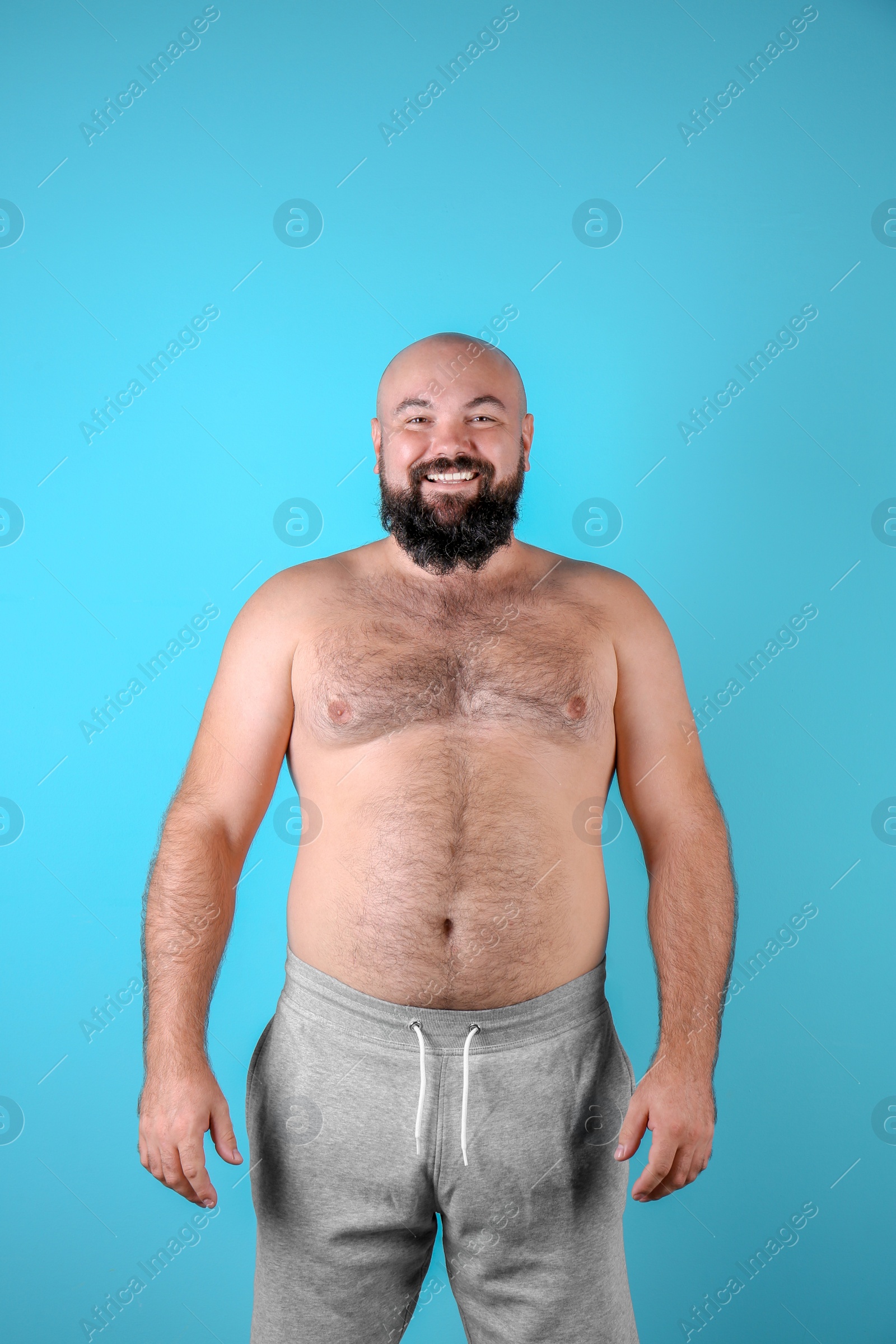 Photo of Fat man on color background. Weight loss