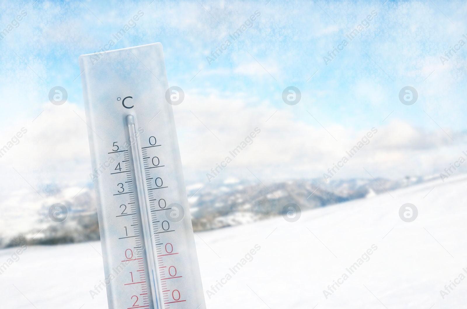 Image of Thermometer showing temperature below zero outdoors on winter day