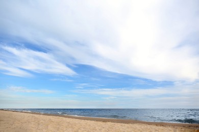 Photo of Beautiful sea coast with seagulls under blue sky