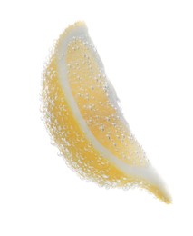 Photo of Slice of lemon in sparkling water on white background. Citrus soda