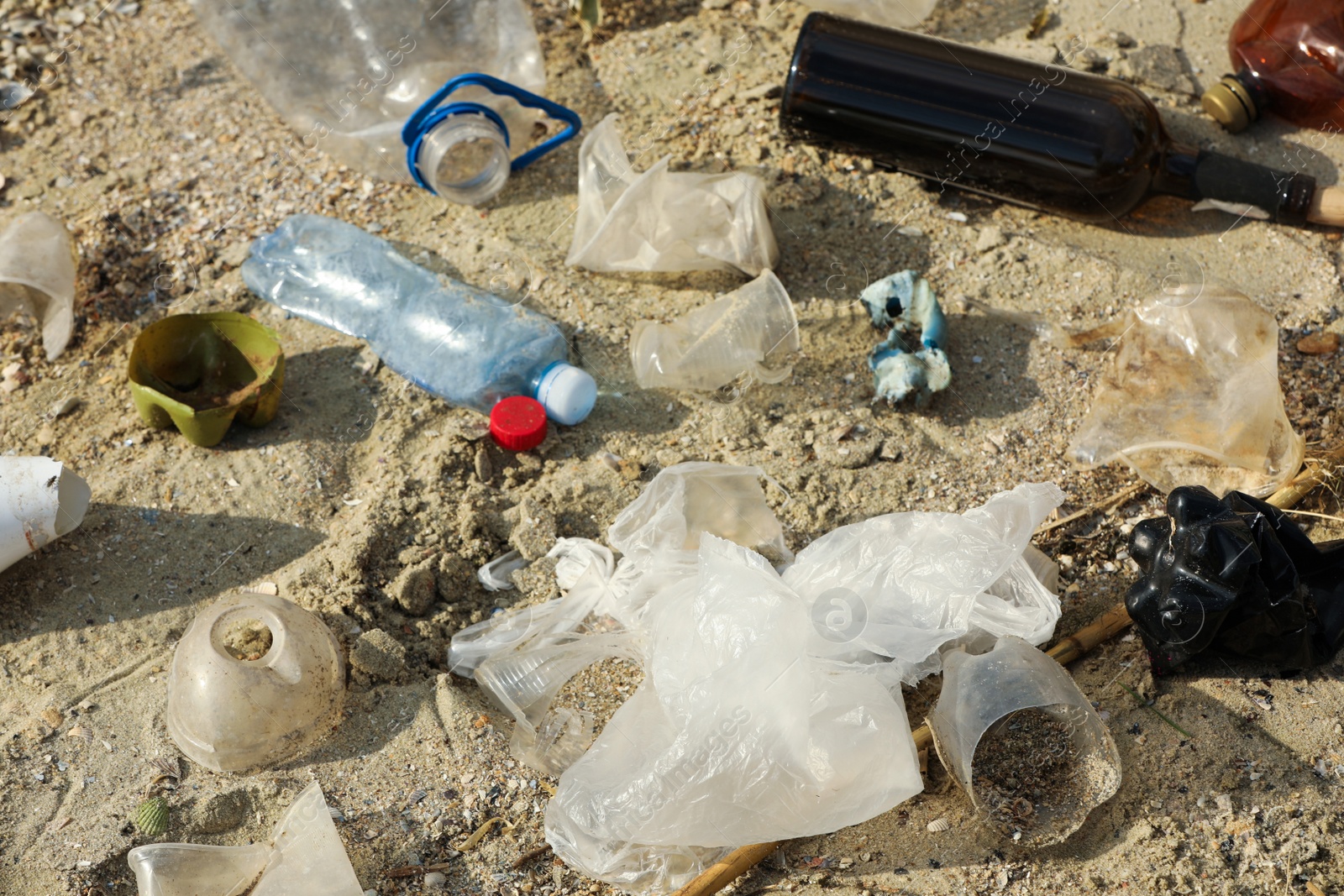 Photo of Garbage scattered on beach. Environment pollution problem