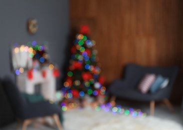 Photo of Blurred view of stylish living room interior with decorated Christmas tree