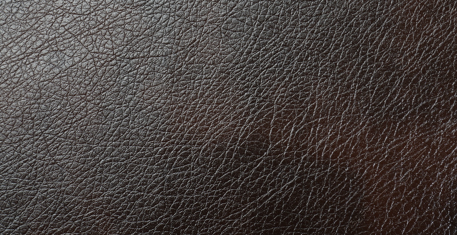 Photo of Texture of brown leather as background, top view