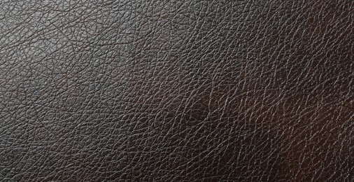 Photo of Texture of brown leather as background, top view