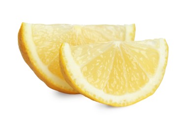 Photo of Pieces of fresh lemon isolated on white