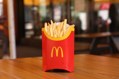 MYKOLAIV, UKRAINE - AUGUST 11, 2021: Big portion of McDonald's French fries on table in cafe