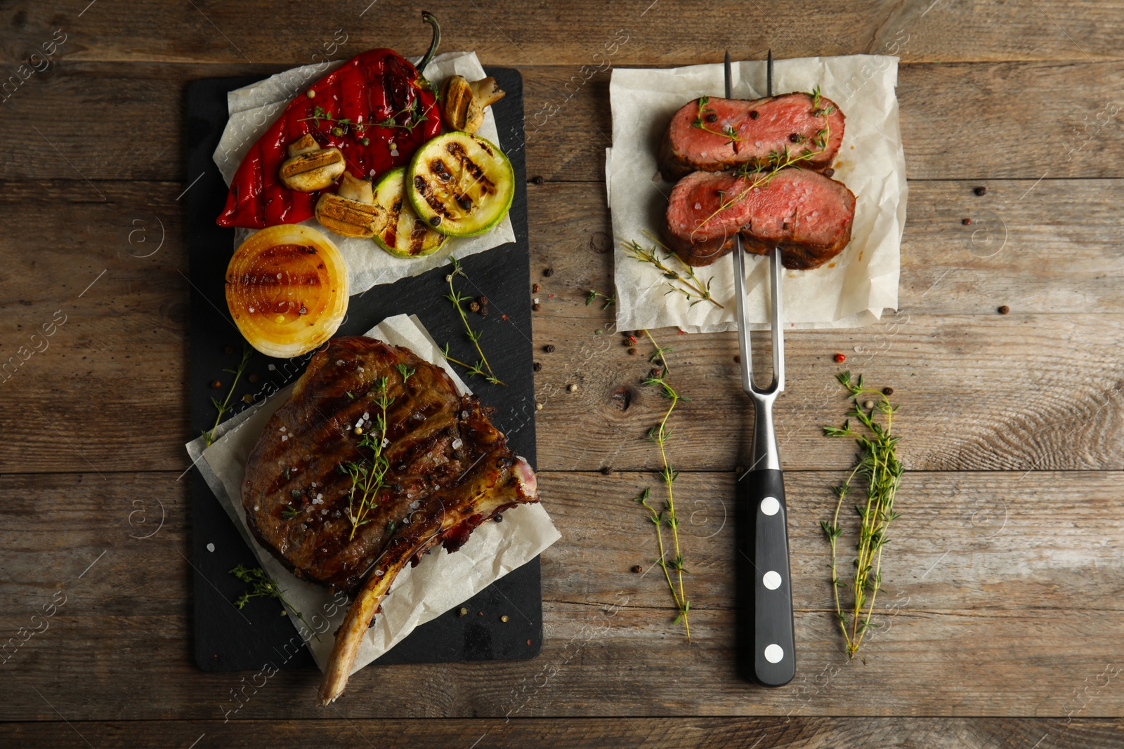 Photo of Flat lay composition with grilled meat on wooden table
