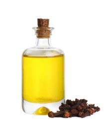 Photo of Essential oil and dried cloves on white background