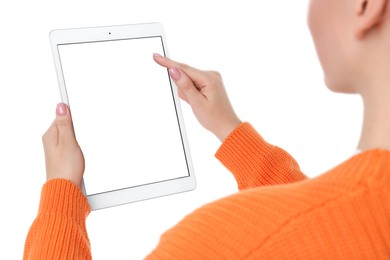 Woman using tablet with blank screen on white background, closeup. Mockup for design