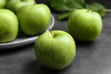 Fresh green apples on table