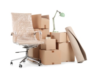 Photo of Cardboard boxes and household stuff on white background. Moving day