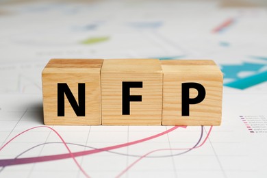 Photo of Cubes with abbreviation NFP on graphical chart