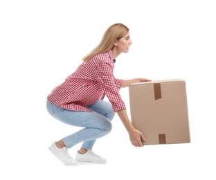 Full length portrait of woman lifting carton box on white background. Posture concept