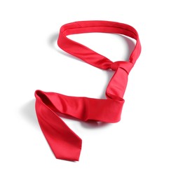 Photo of One red necktie isolated on white, above view