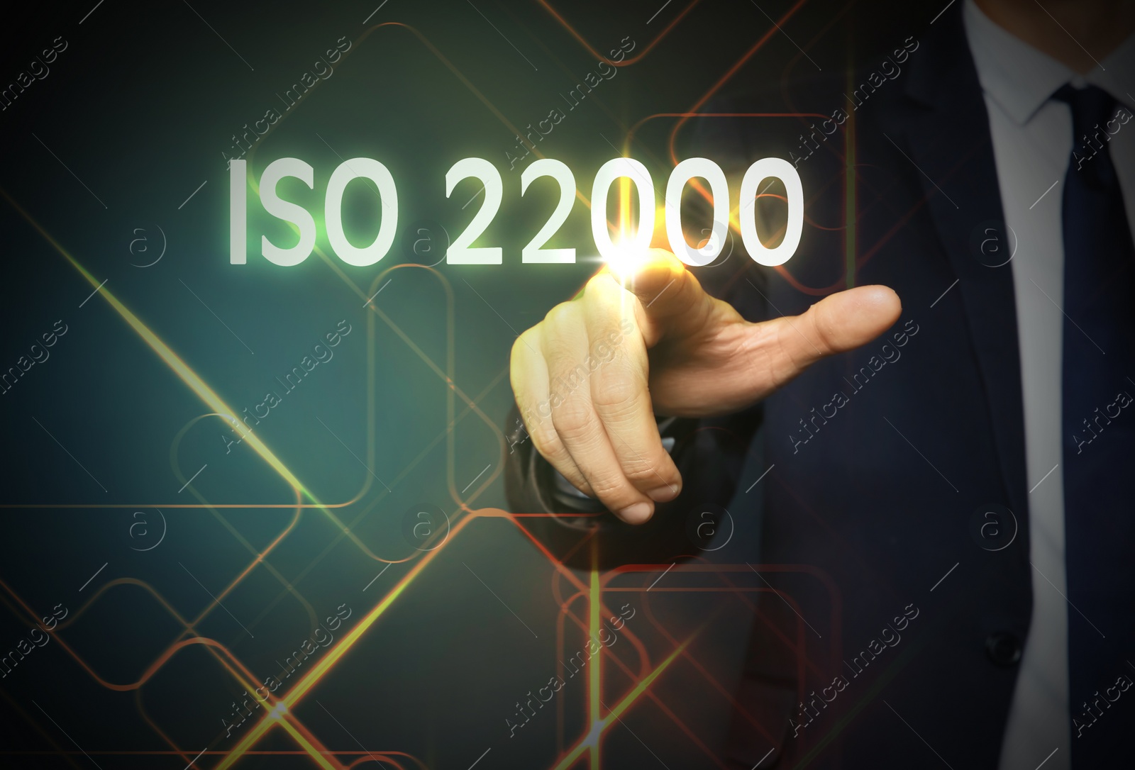 Image of Man pointing at virtual screen with text ISO 22000, closeup