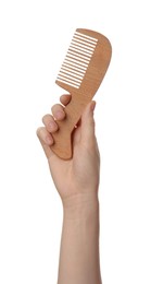 Photo of Woman holding bamboo hair comb on white background, closeup. Conscious consumption