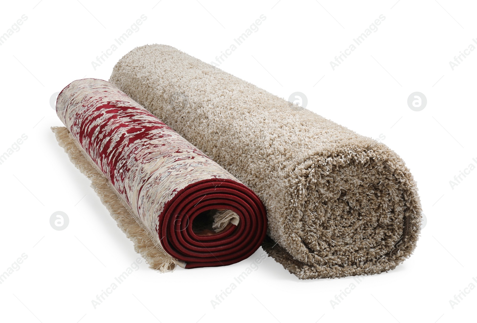 Photo of Rolled carpets on white background. Interior element