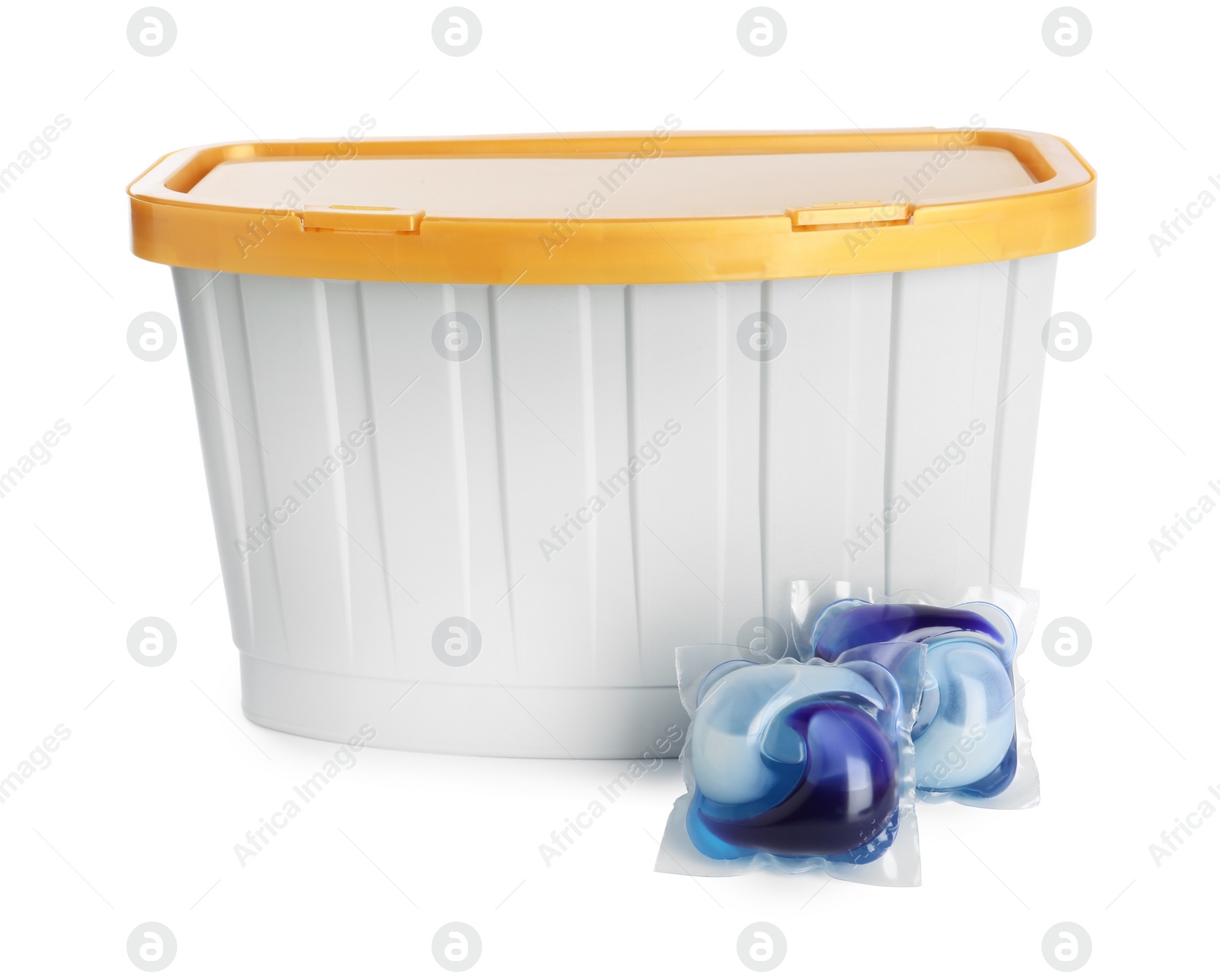 Photo of Laundry capsules and box on white background